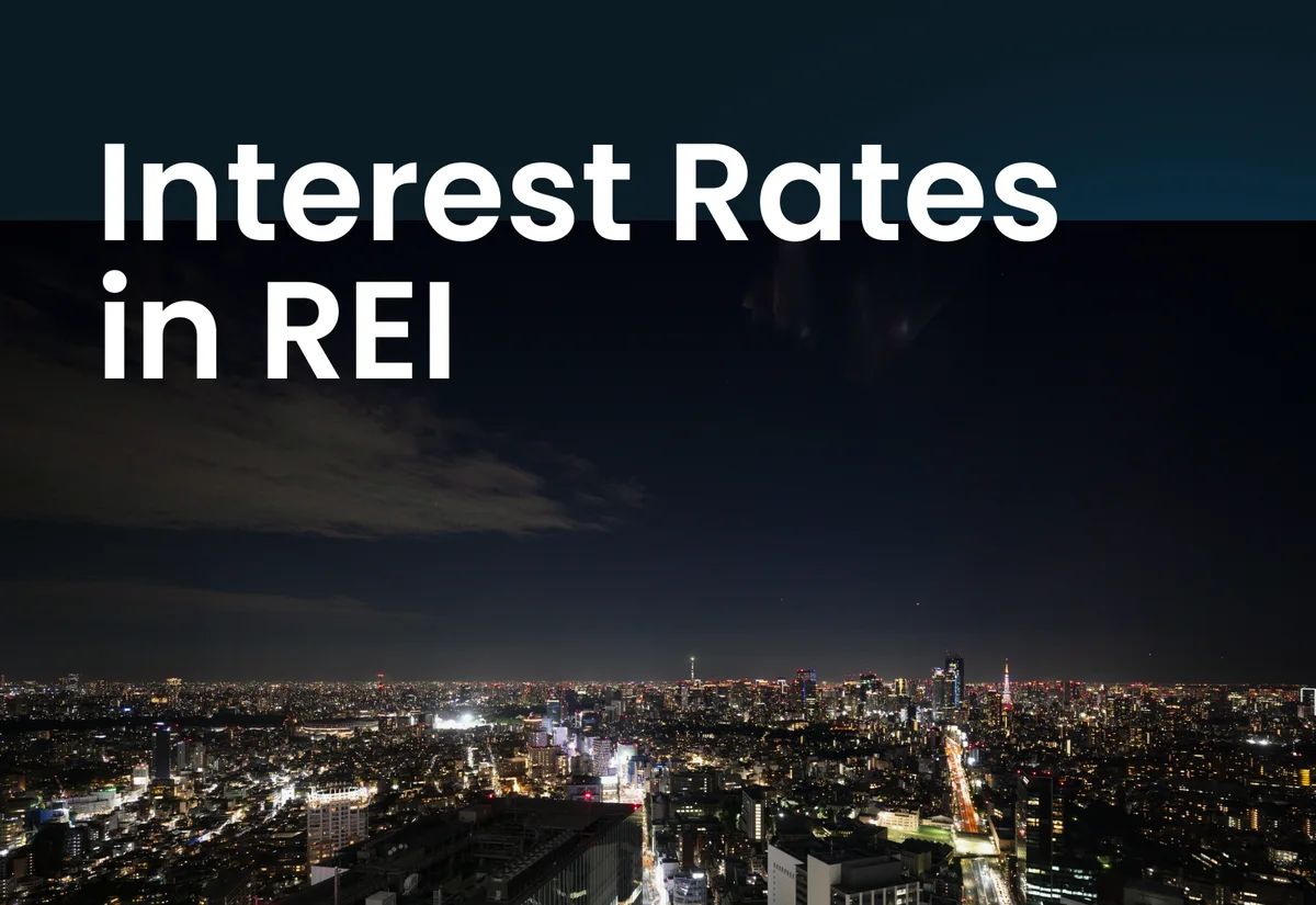 A city skyline at night seen from above, with the words Interest Rates in REI across it
