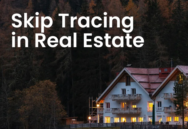 A lit house at dusk against a dark hillside of trees, with the words Skip Tracing in Real Estate across it